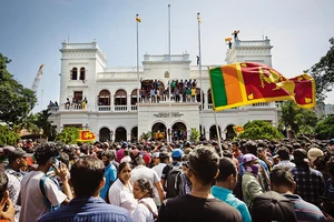 In Our Backyard: Protestors after taking control of Prime Ministers’ office compound in Sri Lanka 