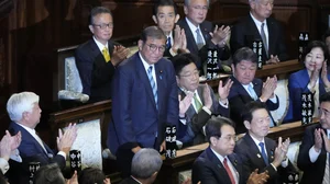 AP : Lawmakers applaud as Japanese Prime Minister Shigeru Ishiba, standing, was elected for a new prime minister at a special parliamentary session of the lower house Monday, Nov. 11, 2024, in Tokyo.