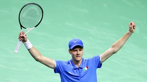 Jannik Sinner celebrates after converting match point