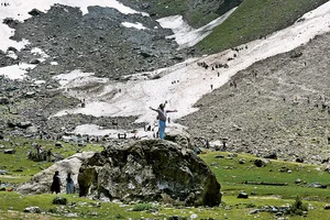 Photo: Yasir Iqbal : Tourism Takes Over: A tourist getting clicked near the Thajiwas glacier