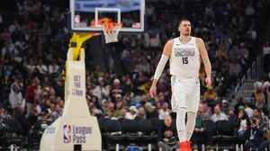 Nikola Jokic #15 of the Denver Nuggets looks on against the Philadelphia 76ers during the third quarter at Ball Arena on January 21, 2025 in Denver, Colorado.