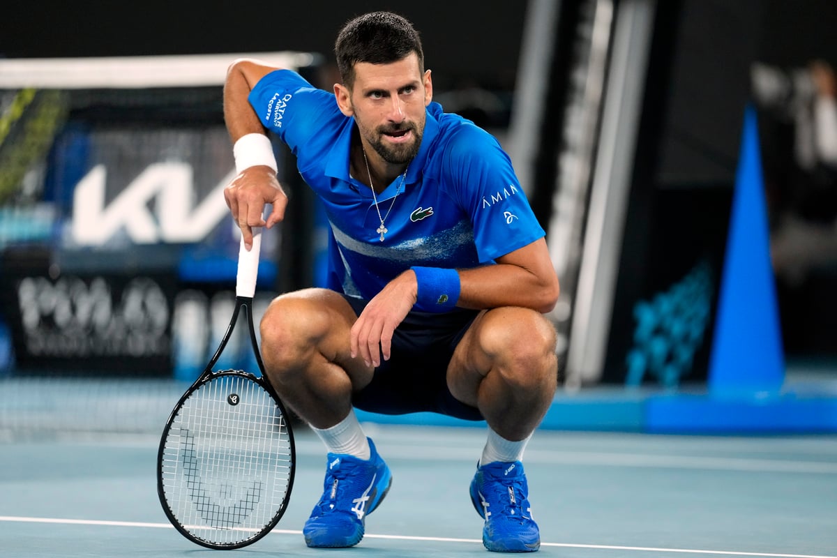 Novak Djokovic of Serbia reacts during his quarterfinal match against Carlos Alcaraz of Spain at the Australian Open tennis championship in Melbourne, Australia, Tuesday, Jan. 21, 2025. 


