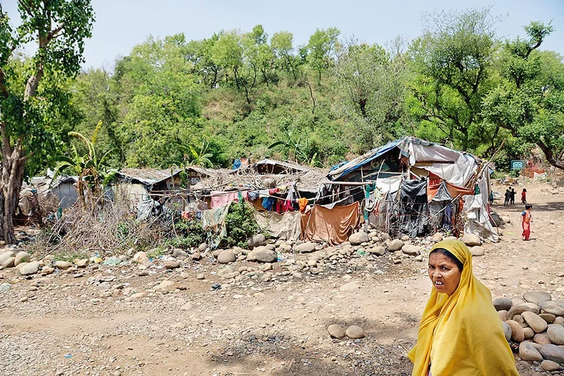 A Rohingya refugee in front of the camp in Jammu.