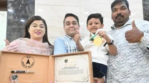 Photo: File : Indian swimmer Reyansh Khamkar with his parents.