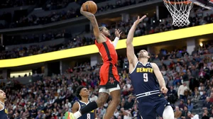 Jalen Green #4 of the Houston Rockets dunks on Dario Saric #9 of the Denver Nuggets in the third quarter at Ball Arena on January 15, 2025 in Denver, Colorado.