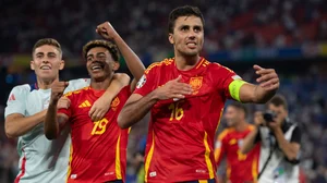 Rodri (right) and Yamal (centre) have been included in UEFA's Team of the Tournament