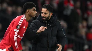 Ruben Amorim and Marcus Rashford interact on the touchline duirng United's match against Bodo/Glimt in November.