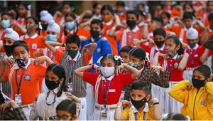 PTI : Students wearing masks attend a morning assembly inside a school (Representative image)