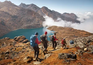 Shutterstock : Group of tourists with backpacks along the Himalayan trek