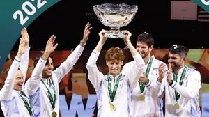 Jannik Sinner lifts the Davis Cup after Italy's triumph