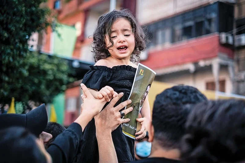 The image of a young girl clicked at her father’s funeral in Beirut 