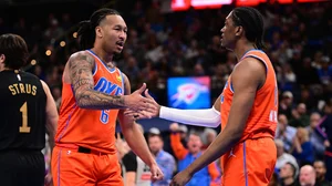 Jalen Williams #8 and Jaylin Williams #6 of the Oklahoma City Thunder celebrate during the second half against the Cleveland Cavaliers at Paycom Center on January 16, 2025 in Oklahoma City, Oklahoma.