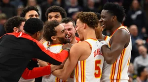 Trae Young #11 of the Atlanta Hawks celebrates with teammates after making the game-winning shot against the Utah Jazz at Delta Center on January 07, 2025 in Salt Lake City, Utah.