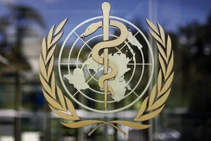 | Photo: AP : World Health Organisation (WHO) symbol |