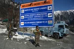 Paramilitary soldiers stand guard near Z-Morh Tunnel at Gagangeer some 82 kilometers from Srinagar, on January 12, 2025 in Srinagar, India.